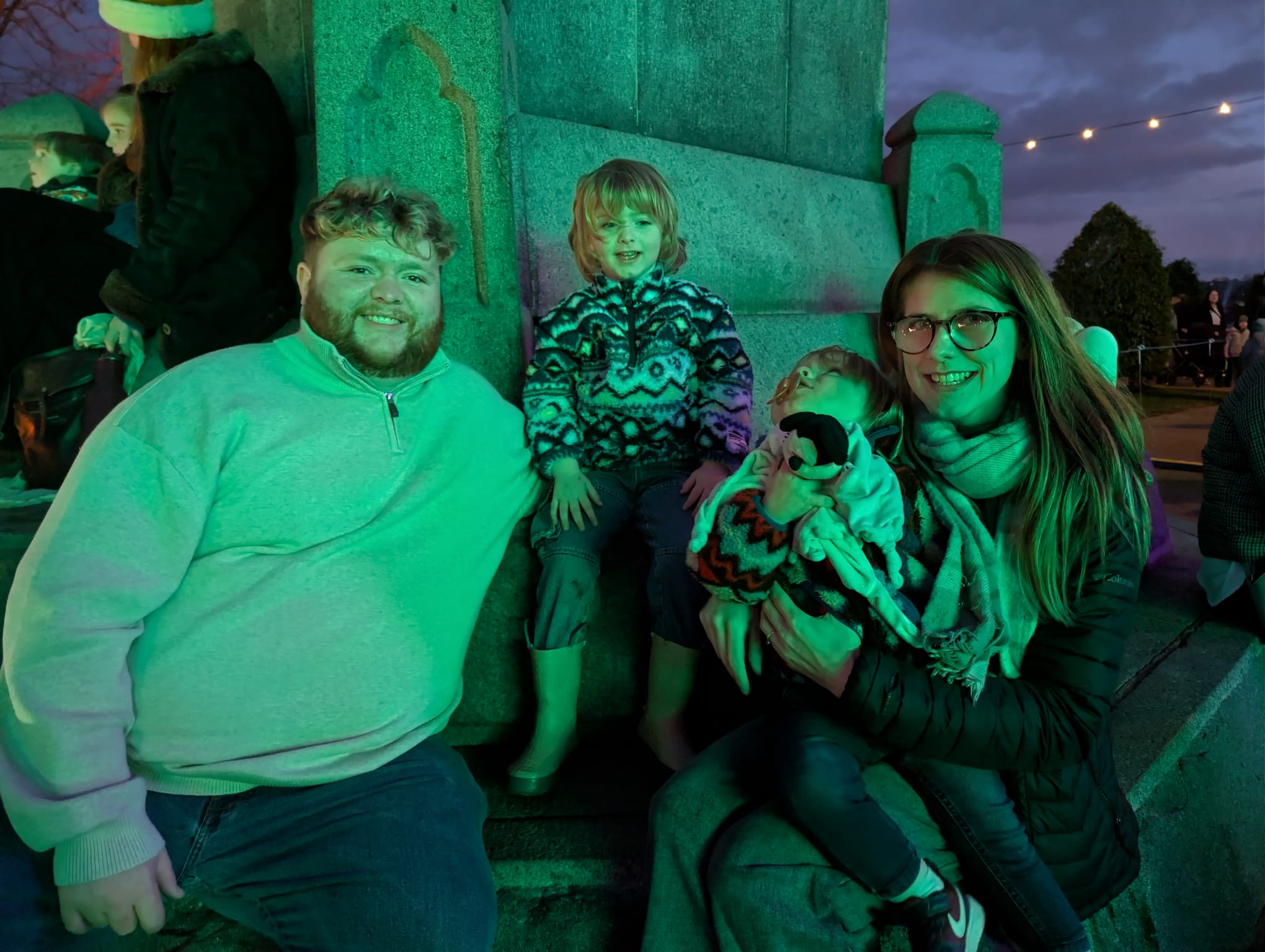 Tait and Abby with their family at an evening light display